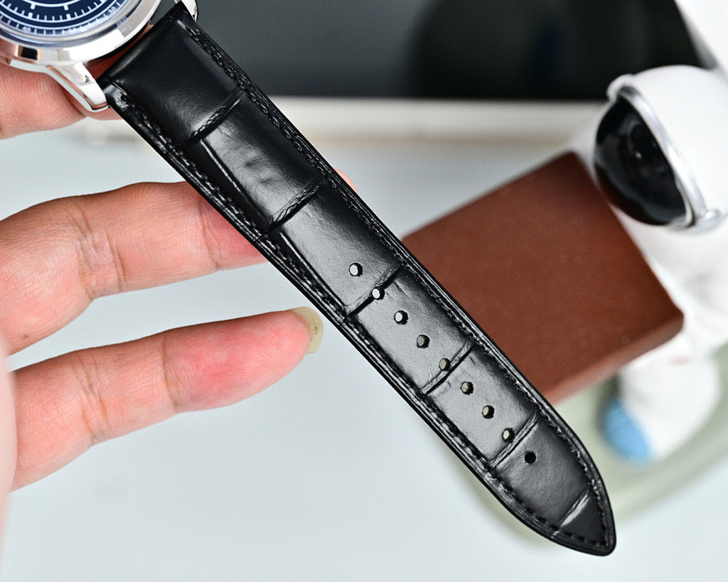 Black leather watch strap with stitched holes and polished buckle