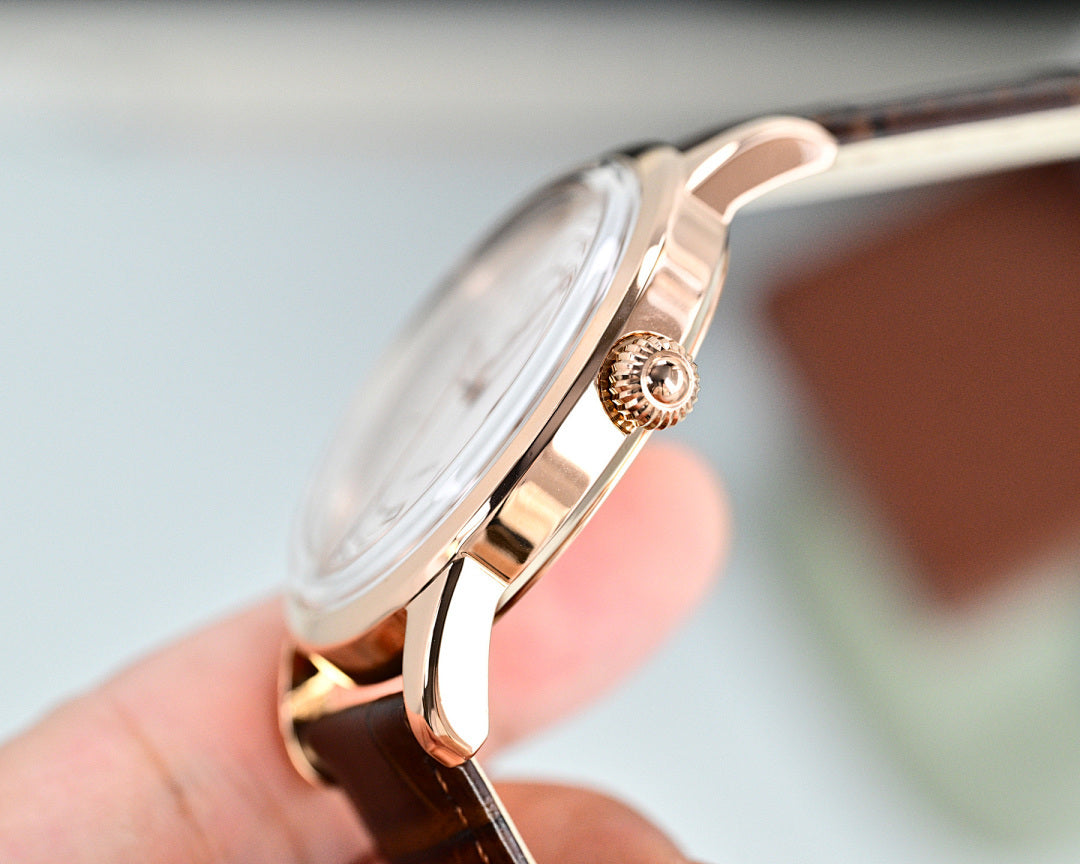 Rose-tone Omega wristwatch with crown detail and open side profile
