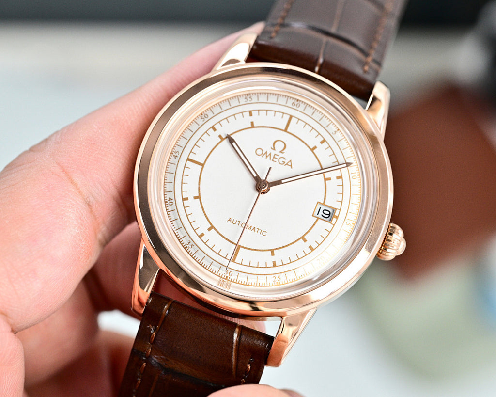 Rose-tone Omega automatic wristwatch with brown leather strap and white dial