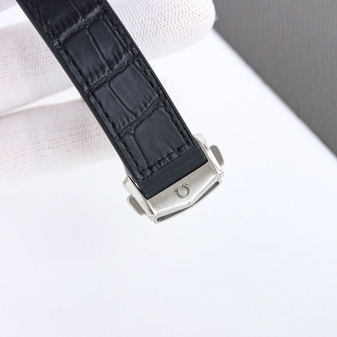 Omega wristwatch buckle with black leather strap and silver case back.