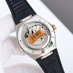 Omega wristwatch case back with exposed movement, black leather strap, gold-tone crown.