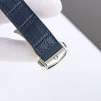 Omega watch strap and silver buckle clasp in dark blue leather, shown from the side