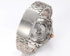 Omega stainless steel watch with black dial, rose-gold bezel and crown, side view
