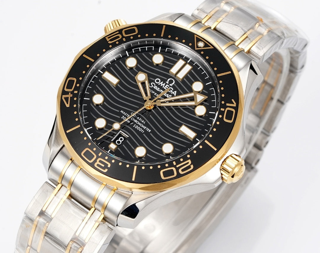 Omega two-tone dive watch angled front with black dial, gold hands, metal bracelet