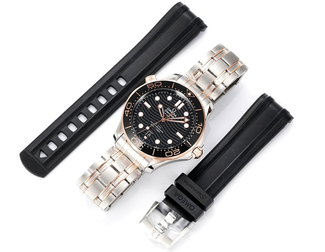Omega watch with black rubber straps and stainless-steel case; black dial with rose accents