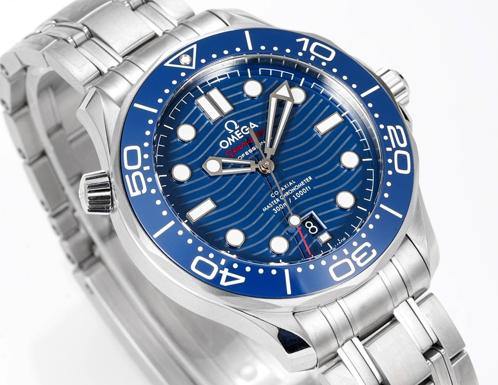Omega watch close-up: blue dial with silver markers and stainless steel bracelet