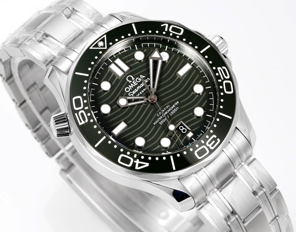 Stainless steel diver wristwatch close-up with green dial, baton markers, and date display