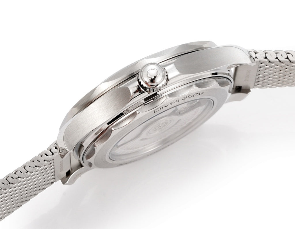 Stainless steel wristwatch side view with crown and textured mesh strap