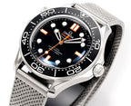 Wristwatch front with black dial, orange hour markers, bezel and mesh band
