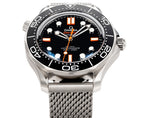 Wristwatch front view with black dial, orange markers, and stainless mesh band
