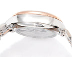 Stainless steel watch caseback with rose-gold rim and crown