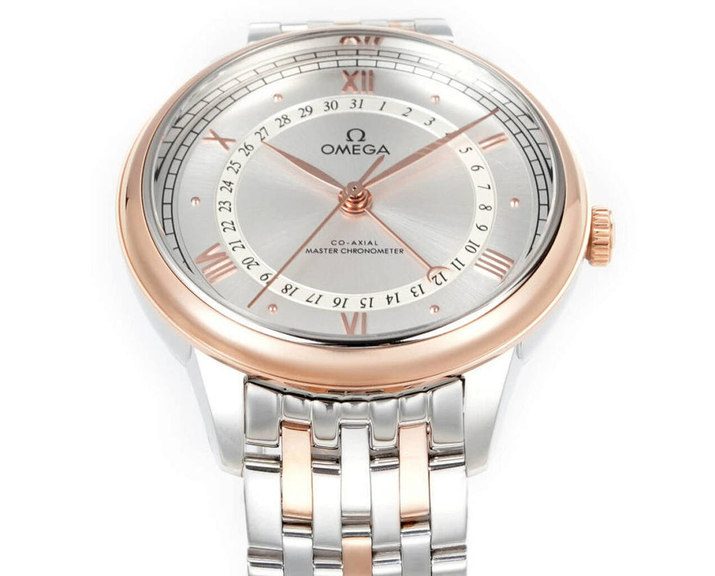 Wristwatch face close-up with light dial, Roman numerals, rose-gold hour markers