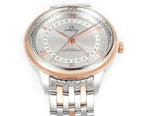 Wristwatch face close-up with light dial, Roman numerals, rose-gold hour markers