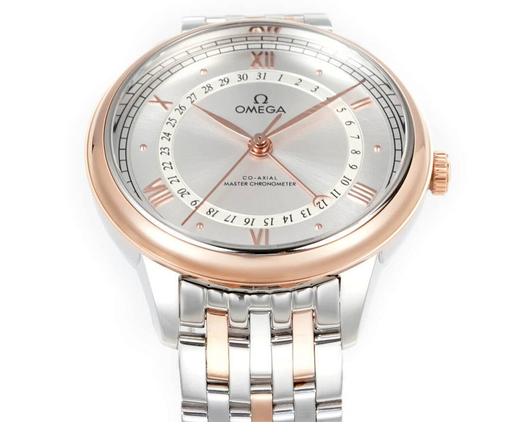 Wristwatch face close-up with light dial, Roman numerals, rose-gold hour markers