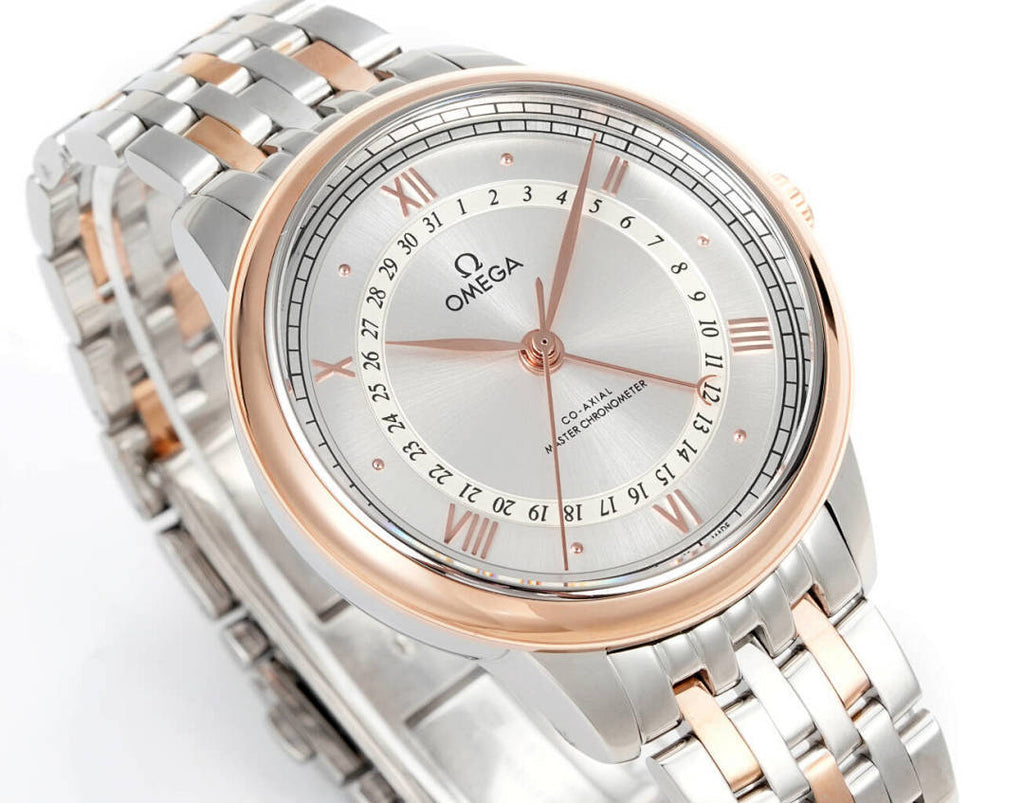 Angled wristwatch with silver bracelet, rose-gold bezel, light dial and Roman numerals