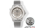 Stainless steel diver watch with gray mesh bracelet and silver dial, three-hand design.