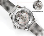 Stainless steel watch caseback with visible movement and gray mesh band, angled view.