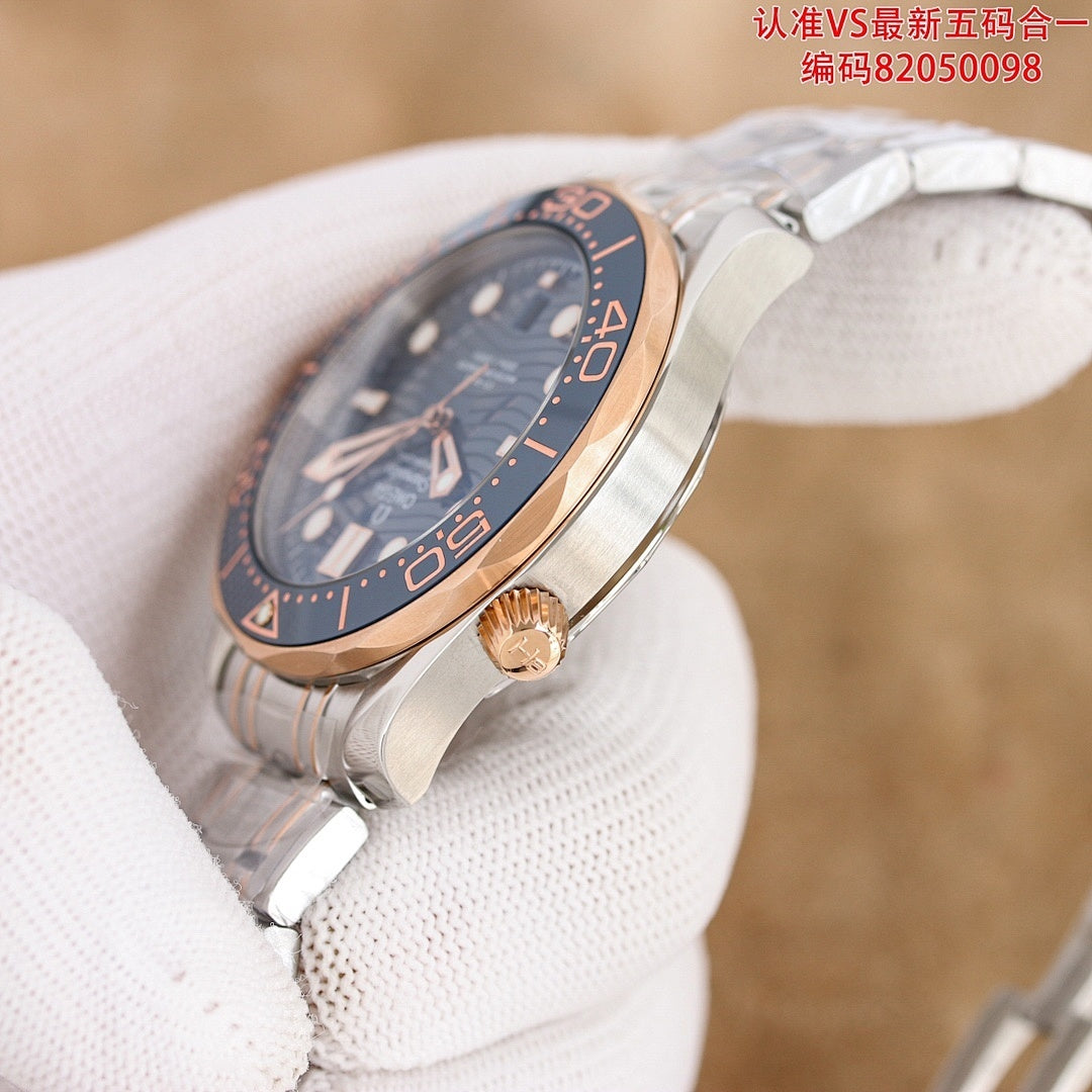 Omega watch with dark blue dial and rose-gold case, crown detail on wrist