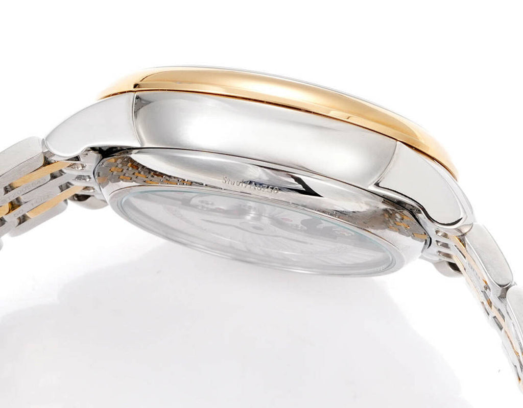 Omega watch rear case view with gold trim and clear back window on metal bracelet