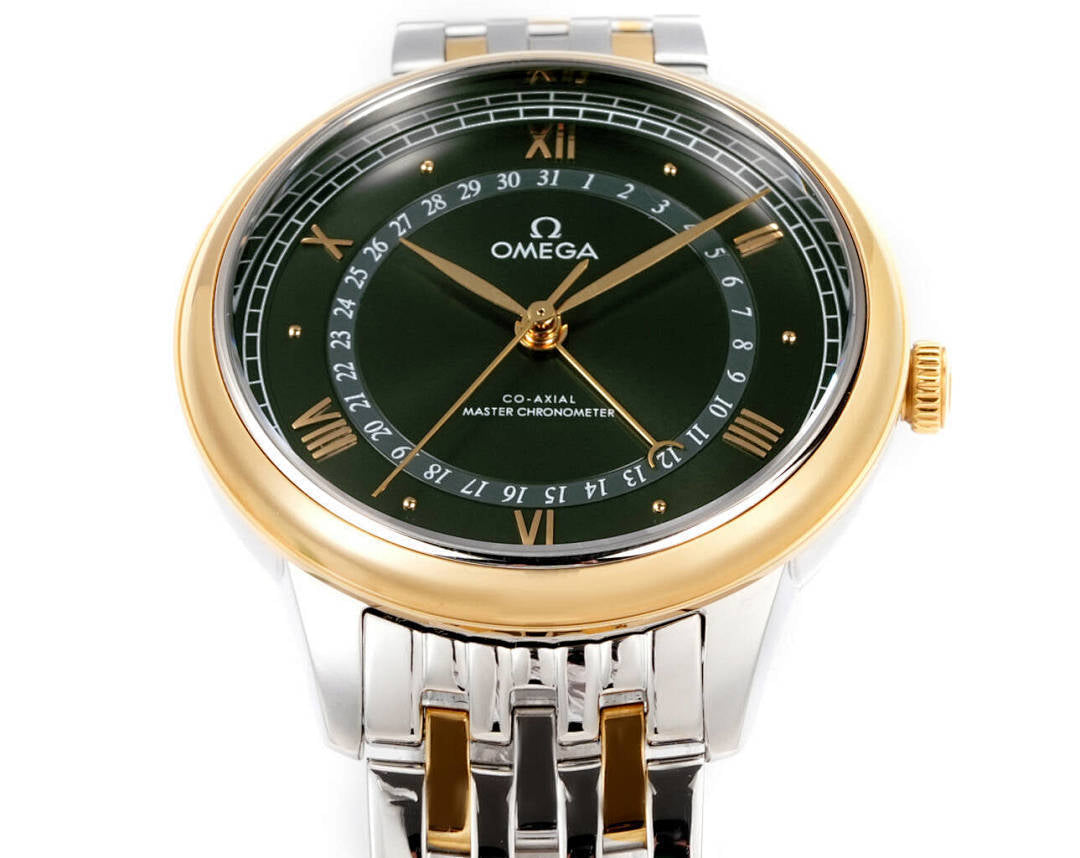 Omega watch front with green dial, gold bezel, roman numerals, two-tone metal bracelet