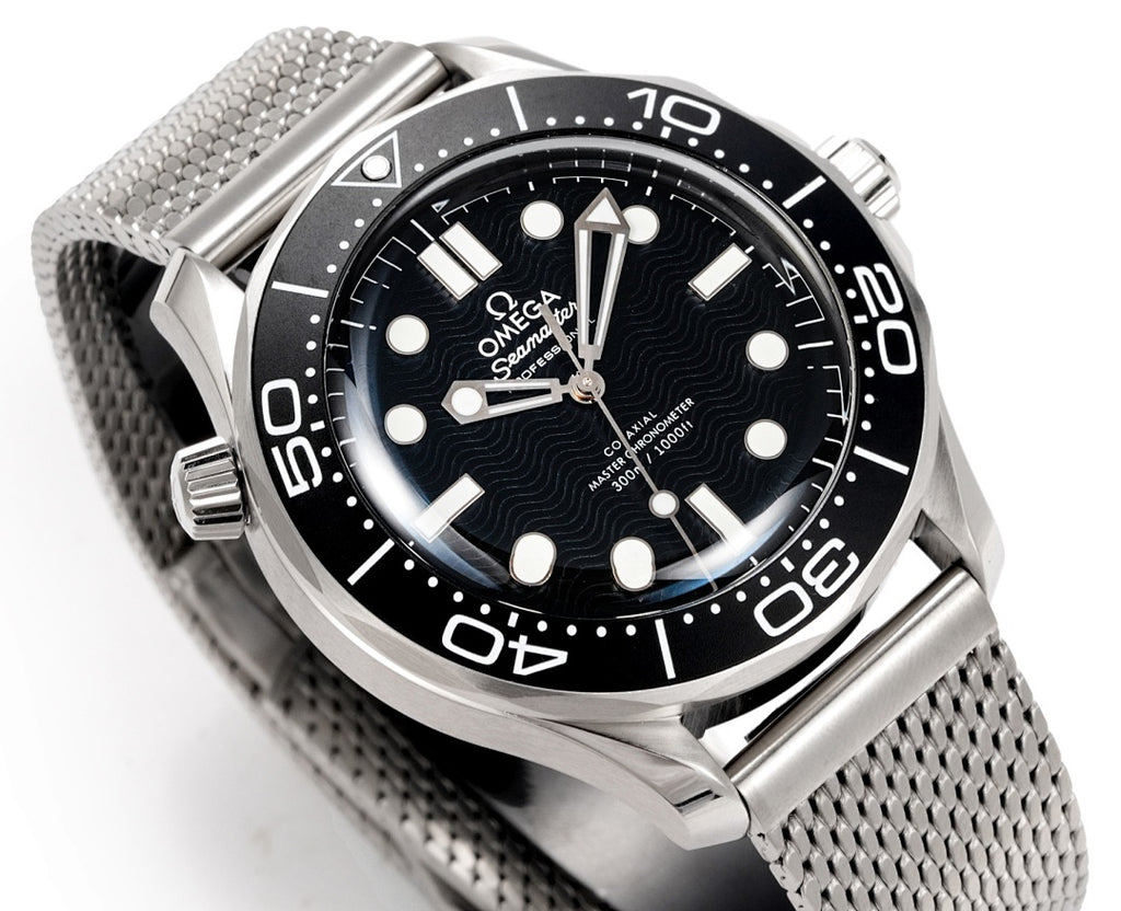 Stainless steel diver wristwatch angled view, black dial with luminous hour markers
