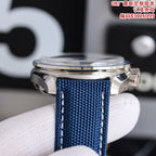 Omega Speedmaster watch side view with blue fabric strap and metal case
