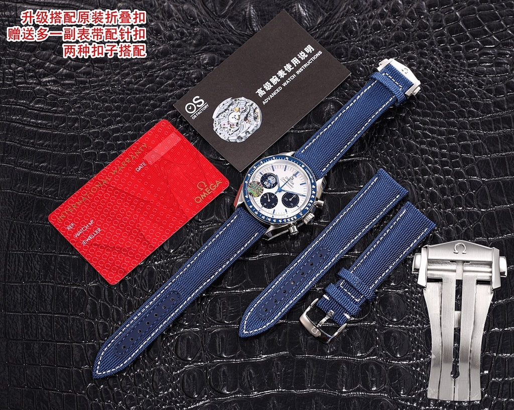 Omega Speedmaster wristwatch set with blue strap and metal bracelet clasp, on dark leather