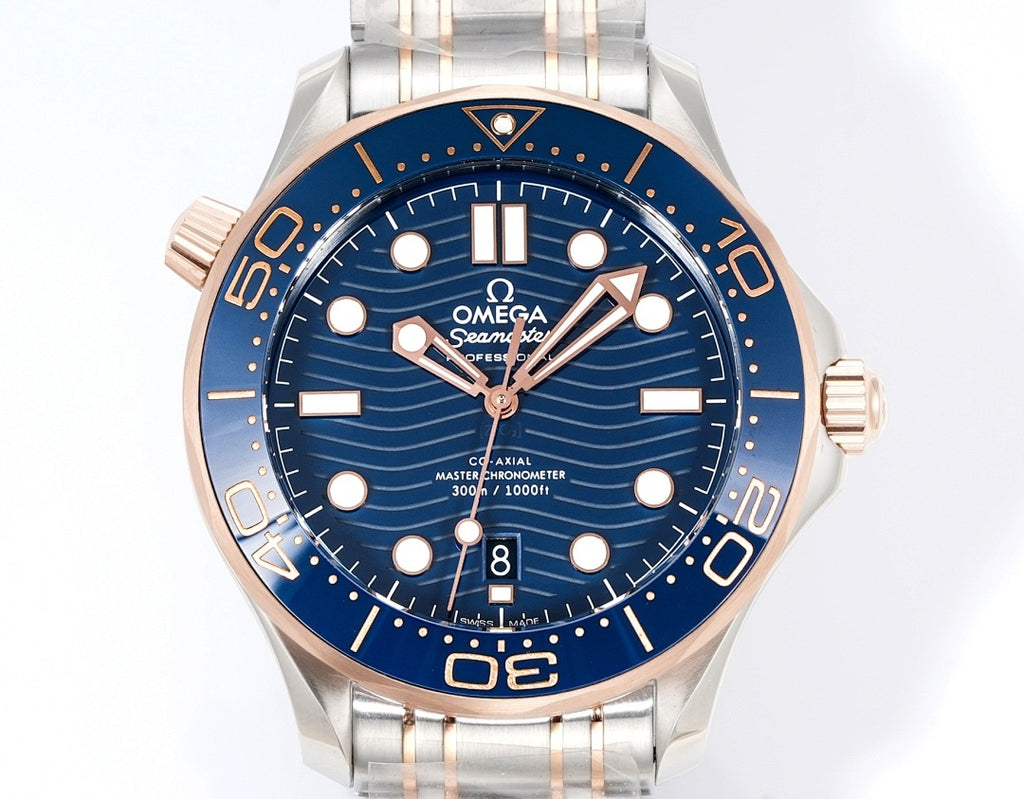 Wristwatch front view with blue dial, steel bracelet, and rose-gold bezel trim