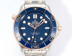 Wristwatch front view with blue dial, steel bracelet, and rose-gold bezel trim