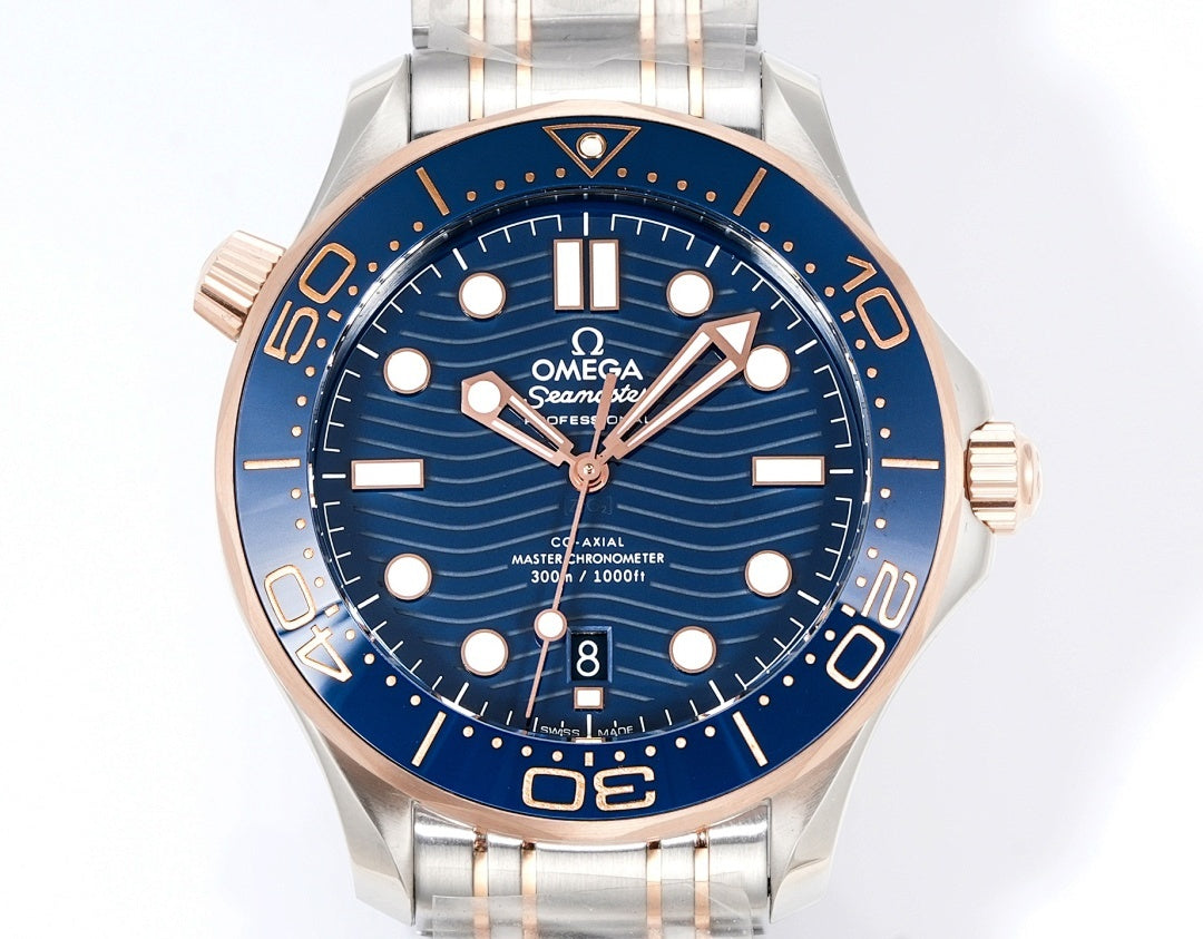 Wristwatch front view with blue dial, steel bracelet, and rose-gold bezel trim