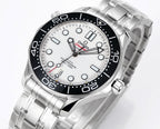 Men's Omega Seamaster close-up, white dial with black bezel markers, steel bracelet.