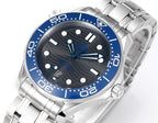 Omega stainless dive watch face with blue bezel, dark dial, and metal bracelet