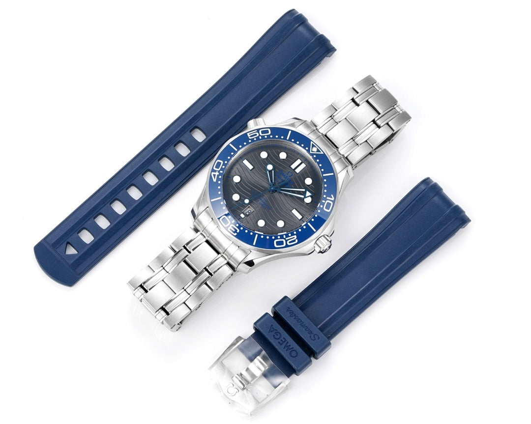 Omega watch shown with blue rubber strap and stainless bracelet