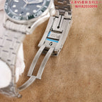 Omega watch clasp detail on stainless steel bracelet with deployment hardware.