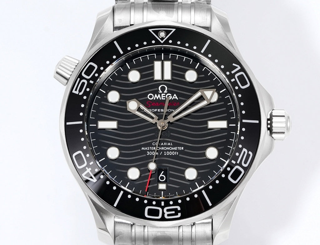 Stainless steel diver watch front view with black dial, lume markers, and metal bracelet.