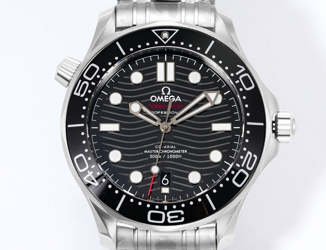 Stainless steel diver watch front view with black dial, lume markers, and metal bracelet.