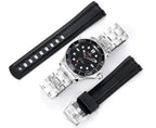 Stainless steel diver watch shown with metal bracelet and matching black rubber strap.