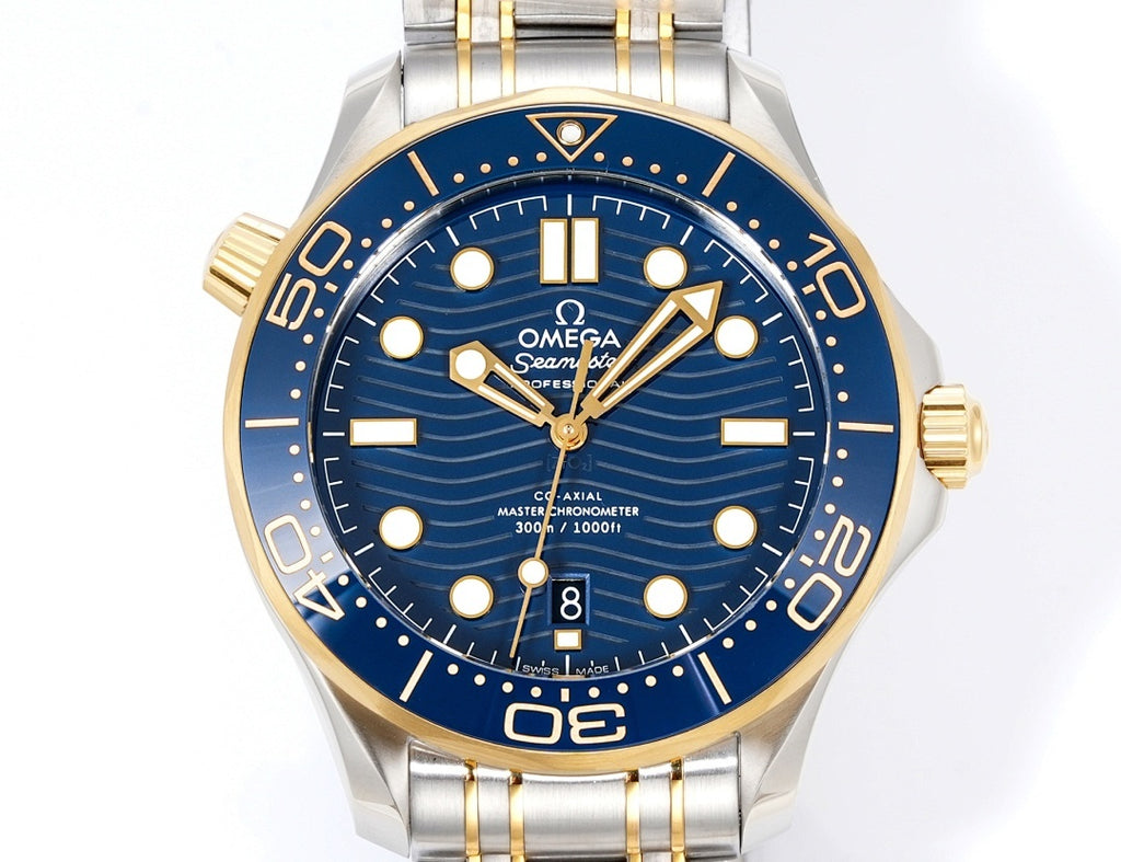 Omega watch front view with blue dial, gold markers, gold hands, and two-tone stainless bracelet