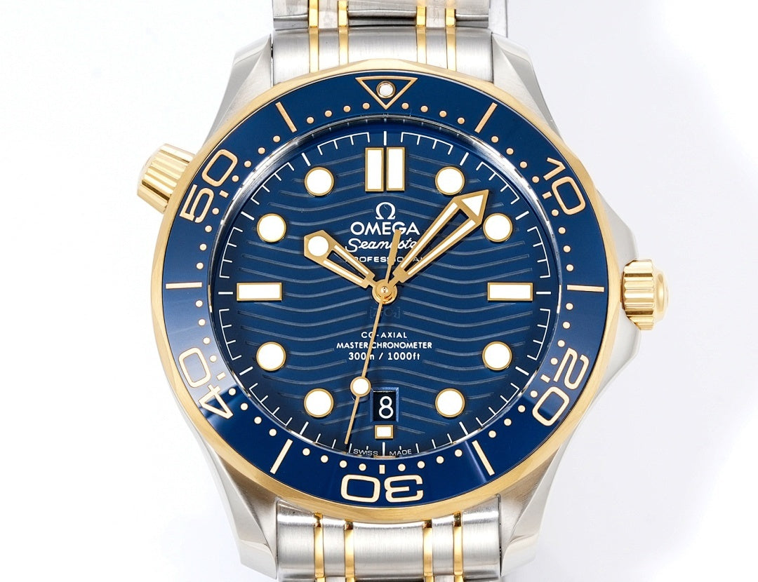 Omega watch front view with blue dial, gold markers, gold hands, and two-tone stainless bracelet