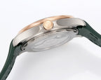 Omega watch case and crown close-up with green rubber strap