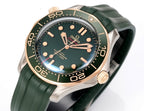 Omega watch front view with green dial, gold bezel, and green rubber strap