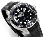 Omega watch angled front view with black dial, silver hands, black rubber strap.