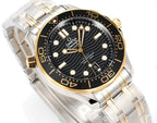 Omega diver watch front angled view with black dial, gold hands, and two-tone bracelet.