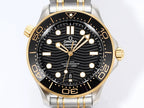 Omega diver watch front view with black dial, gold indices, and two-tone bezel.