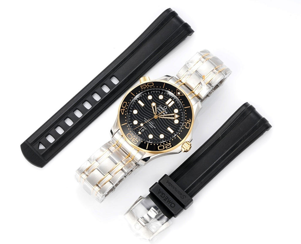 Omega diver watch shown with black rubber straps and two-tone case and bezel.