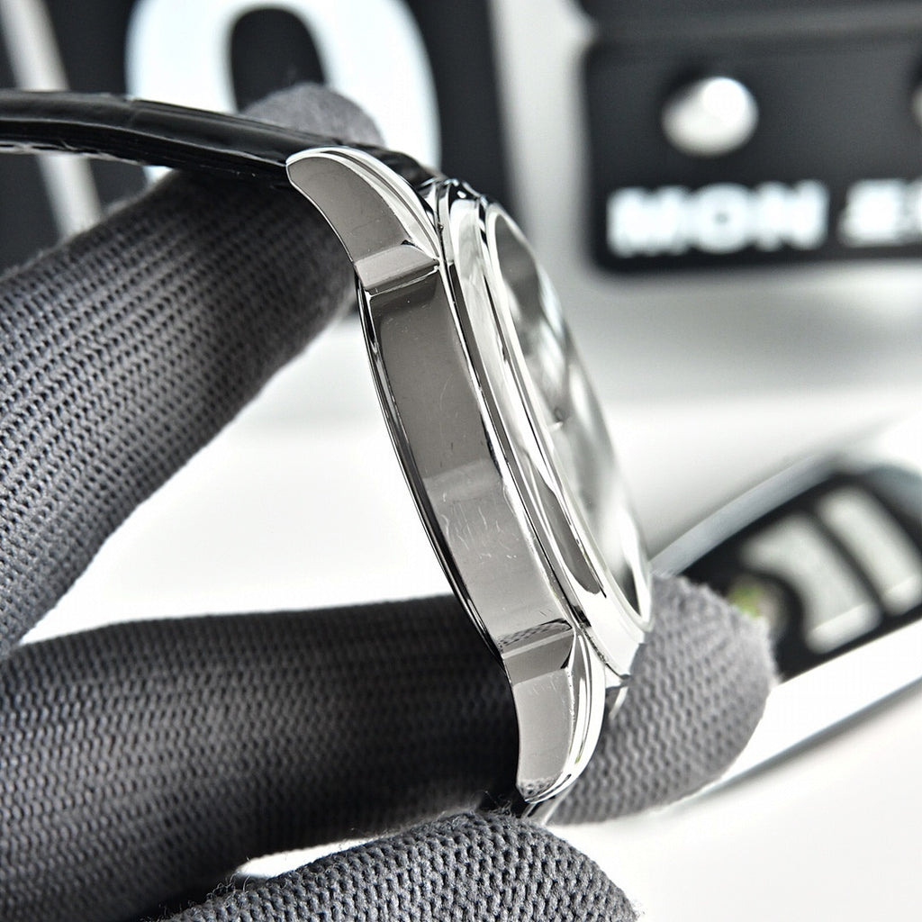 Omega Seamaster watch with silver case and black leather strap, side profile