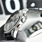 Omega Seamaster watch showing crown and side controls, black leather strap