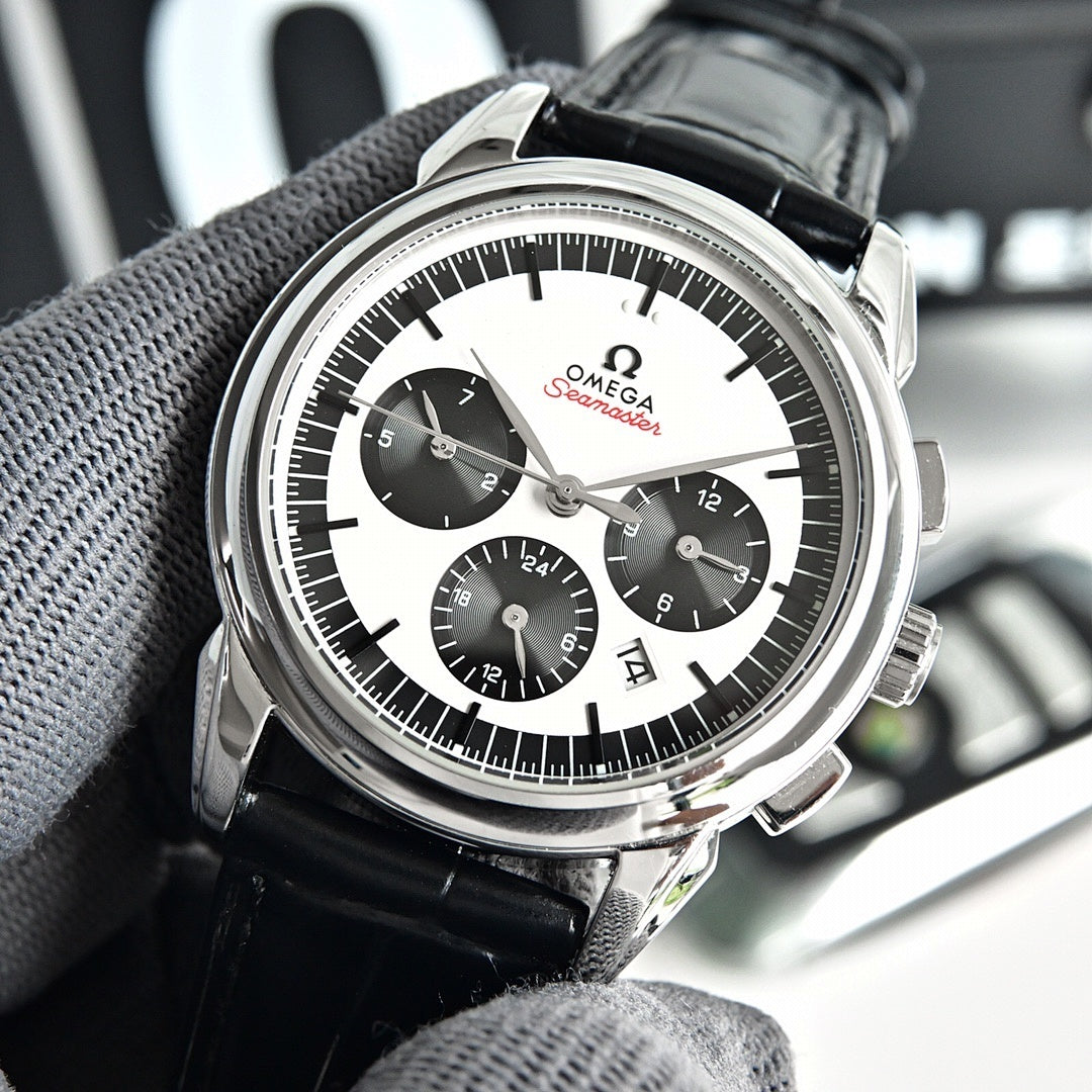 Omega Seamaster chronograph watch on grey glove, white dial and black leather strap