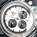 Omega Seamaster chronograph watch face with white dial, black subdials, silver bezel