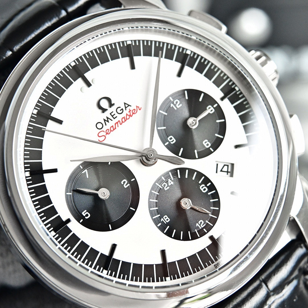 Omega Seamaster chronograph watch face with white dial, black subdials, silver bezel